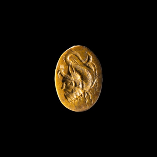 A Roman Imperial yellow jasper intaglio. Gryllos.